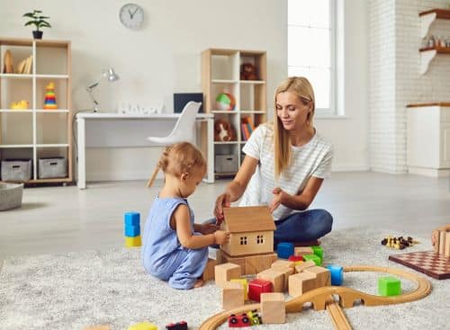 a child and a woman playtime as representation for the topic about internet marketing for child care services