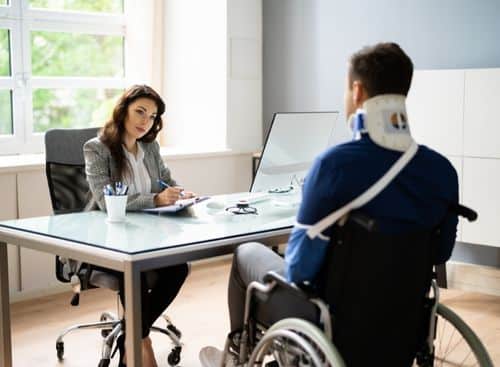 lady lawyer and a client with support sitting in the table as representation for the topic about disability lawyers internet marketing services