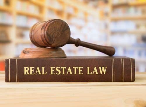 Real estate law book and gavel