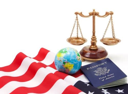 US flag, globe, passport and justice scale as representation for the topic about internet marketing for immigration lawyers